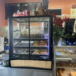 a display case filled with donuts