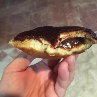 Filled donut ... only halfway stuffed