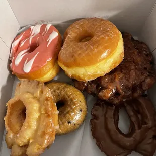 a variety of doughnuts in a box