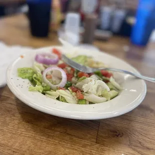 a plate of salad on a table