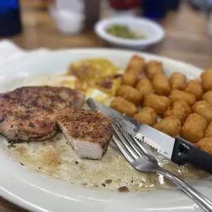 a plate of food with a knife and fork