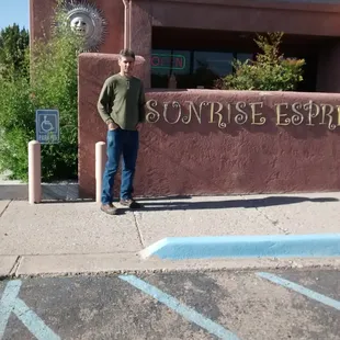 At the shop entrance with that Paul.