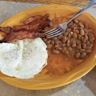 Eggs over medium with bacon and pintos, $9.75.