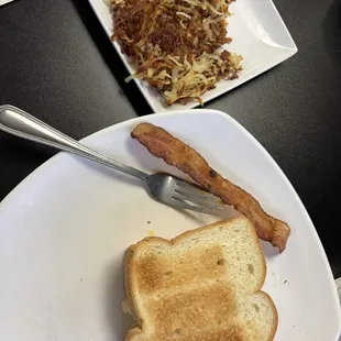 Breakfast sandwich (eggs, meat, cheese) and hash browns (bacon was stolen from hubby )