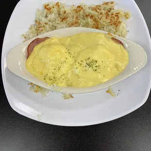 Eggs Benedict with the best hollandaise sauce served in a boat trapping all the goodness! With house made hash browns. Yum!