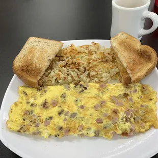 Meat Lovers Omelette with hash browns, toast and coffee.