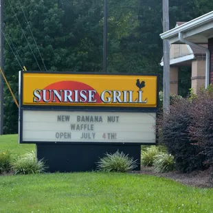 a sign in front of a building