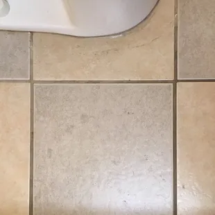 Some weird stains on bathroom floor