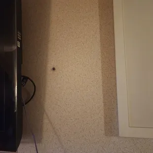 Cigarette burn on the wall