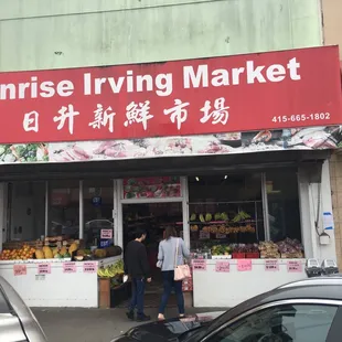 people walking in front of the store