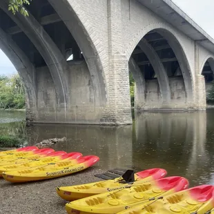 Sunset kayaks near the stone bridge