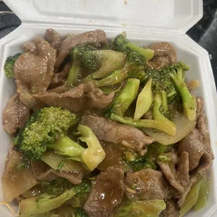 Beef and broccoli on a bed of noodles