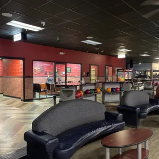 seating area with bowling lanes in background