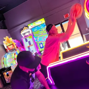 two men playing a game of basketball