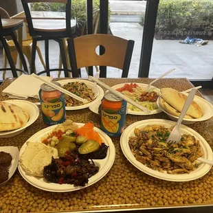 Two shwarma plates with side salads and Falafel Balls