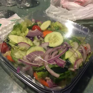 a salad in a plastic container