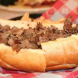 a meat sandwich with french fries