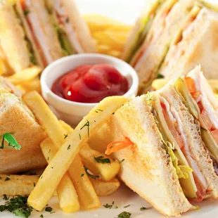 a plate of sandwiches and fries