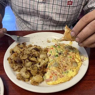 Freezer burnt potatoes, dry omelette, stale toast