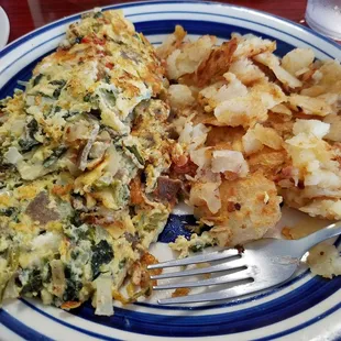 Greek omelet and home fries. I have a huge appetite and could not finish it all. Favorite!!