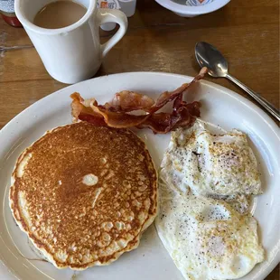 Pancake breakfast with over medium eggs and bacon- all perfectly cooked and delicious!