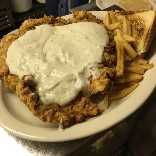 hicken fried with gravy and french fries