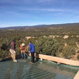 Pressure washing before the APOC Armor Flex Silicone Roof Membrane application.  Serafina, New Mexico.