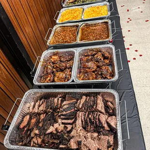 Beef brisket, bbq chicken, baked beans, mac &amp; cheese, collard greens, red rice, coleslaw