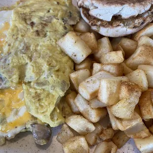 Cheese , Mushroom, onion omlete with potatoes and english muffin