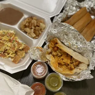 Chorizo, egg, potatoes and cheese tacos. Migas and tamales