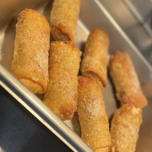 a tray of fried egg rolls