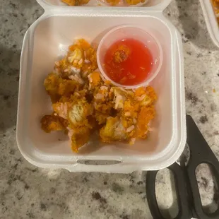 two plastic containers with food in them