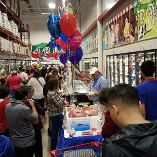 tons of people at the food festival in the store