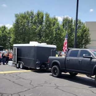 a truck with a trailer in the back