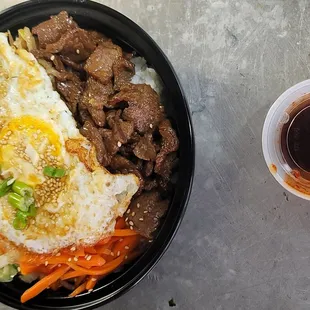 a bowl of food and a drink