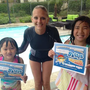 Kids swim lessons - students receive certificate of completion after finishing their swim program