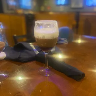 a glass of beer on a table