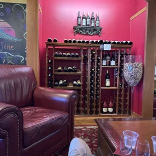 Small wine collection by the seating area