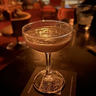 a glass of wine on a table