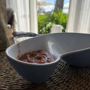 a bowl of chili and a spoon