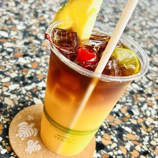 Sunset&apos;s Mai Tai. Citrusy with a lingering caramel finish. Comes with a pineapple wedge.