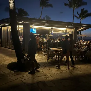 people walking around a restaurant