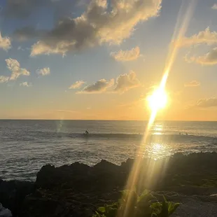 the sun setting over the ocean