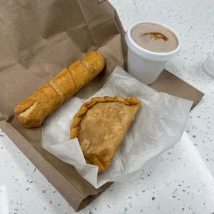 Ham and cheese empanada , tequeño de queso and a colada