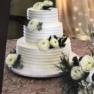 a wedding cake with white flowers