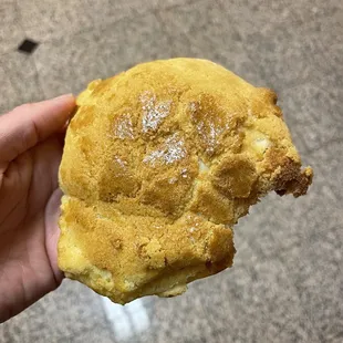 Pineapple bun (with a bite out of it)