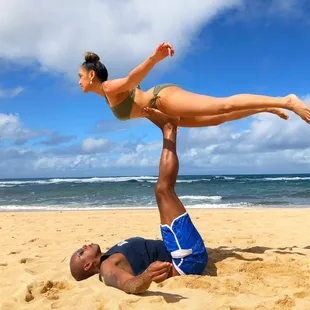 Couples yoga on the beach so relaxing