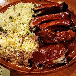 Succulent MX ribs with rice and refried beans.