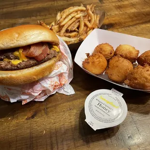 Double cheese burger, fries and hush puppies