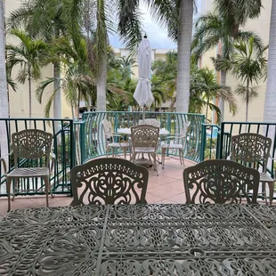 Covered Patio overlooking condo courtyard with fountains